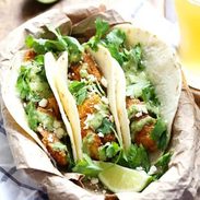 Crispy Fish Tacos with Jalapeño Sauce - beer-battered with a cornmeal crust for an extra yummy texture, plus the spicy-cool combo of that creamy jalapeño sauce. Summer food! | pinchofyum.com