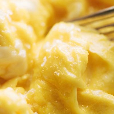 Soft Scrambled Eggs on plate with fork.