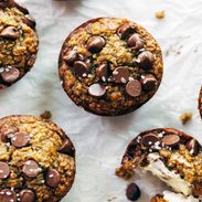 Zucchini muffins with chocolate chips on top.