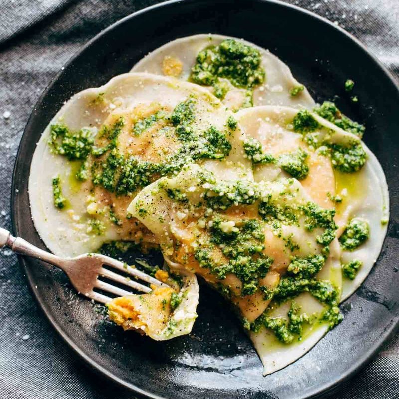 A picture of Jumbo Butternut Squash Ravioli with Kale Pesto