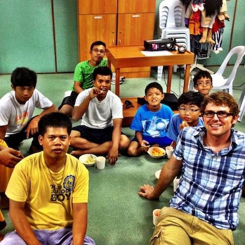 Room filled with men of all ages.