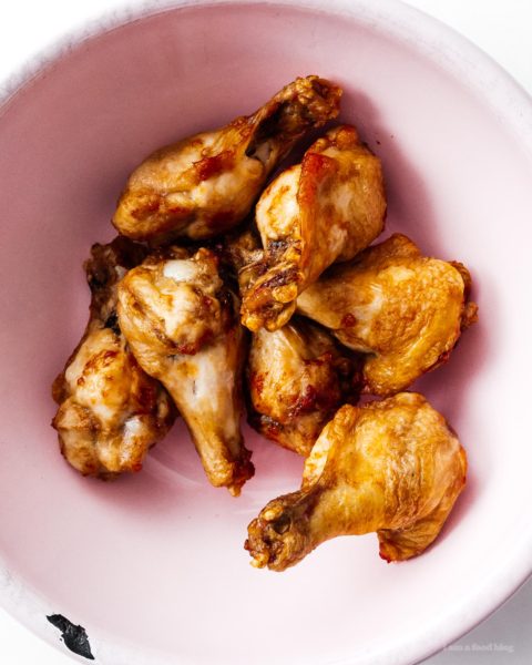 Air fryer chicken wings are so crispy and juicy you won’t believe they weren’t deep fried! Seriously good and so easy. Eat them naked, with salt and pepper, or toss them in a salty, sweet, sour Vietnamese fish sauce that will leave you begging for more. #airfryer #chickenwings #wings #airfryerwings #recipes #dinner #appies #vietnamesefood