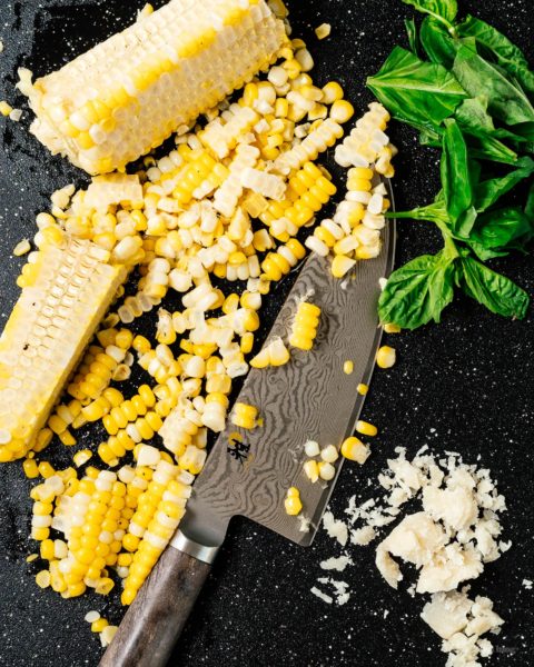 How to cook trader joe’s cauliflower gnocchi with sweet oven roasted tomatoes and corn with the best low carb gnocchi out there: cauliflower gnocchi. Super easy, light, tasty, and filling! #cauliflowergnocchi #traderjoes #cauliflowerrecipes #cauliflower #gnocchi #tomatoes #corn #recipes #dinnerrecipes #dinner