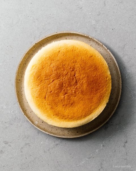 A super cute fluffy, jiggly Totoro cheesecake: pillowy soft, cotton-y, light-as-air cheesecake with just a hint of sweetness. #cheesecake #japanesecheesecake #fluffycheesecake #totorocake #totorocheesecake #totorofood #kawaiifood