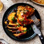 This 6 ingredient sheet pan dinner is your next weeknight rockstar: slightly spicy, slightly sweet Korean inspired chicken with creamy crispy roast potatoes #roastchicken #chicken #recipes #recipe #dinner #easy