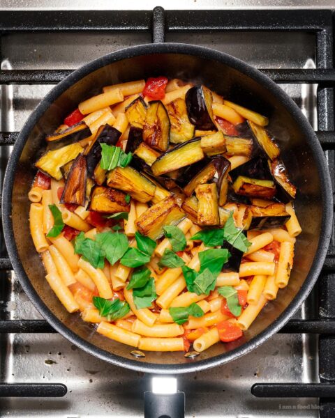 A traditional Sicilian pasta dish made with sautéed eggplant and tomatoes. Meat free, super delicious, and easy! | www.iamafoodblog.com