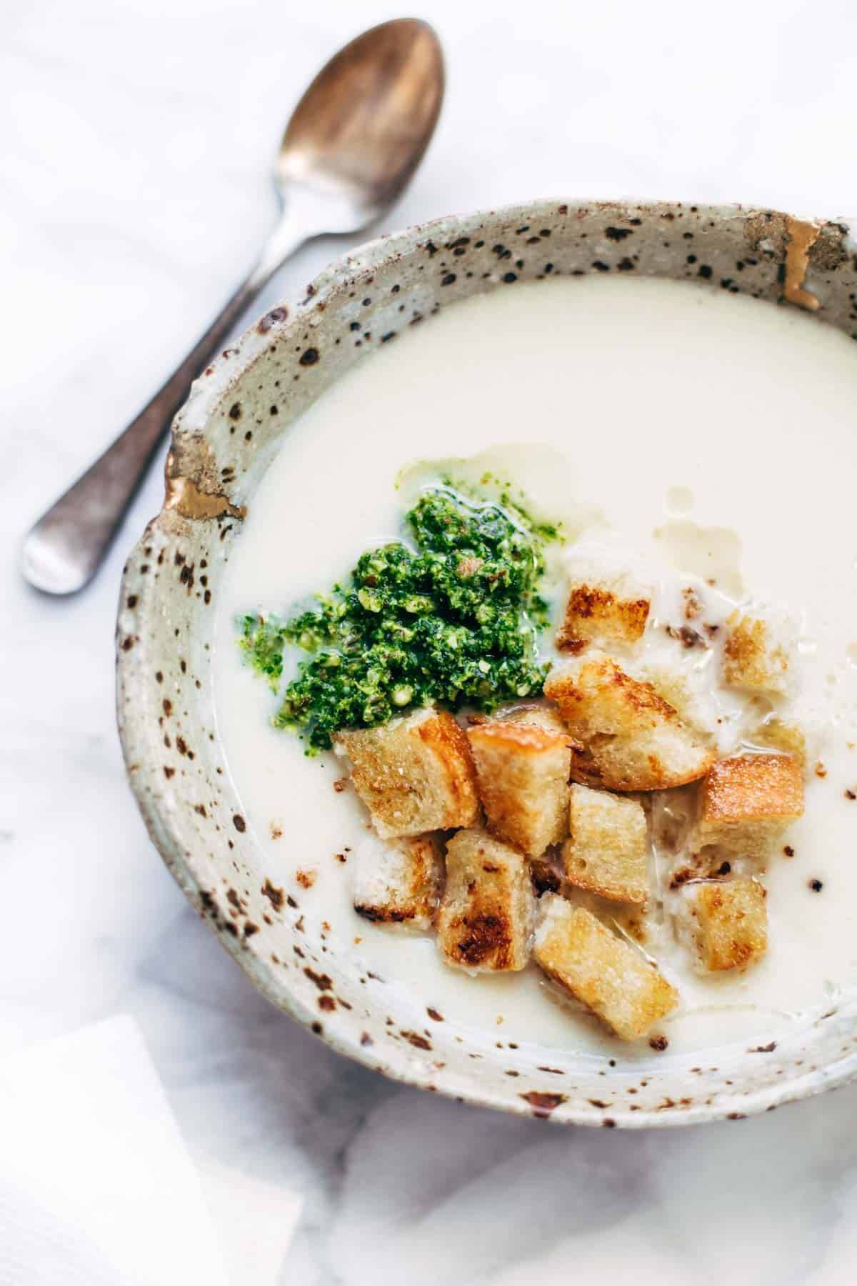 This 5 Ingredient Cheesy Cauliflower Soup is ultra creamy - and all you need is an onion, cauliflower, butter, broth, and cheese! SO EASY. | pinchofyum.com