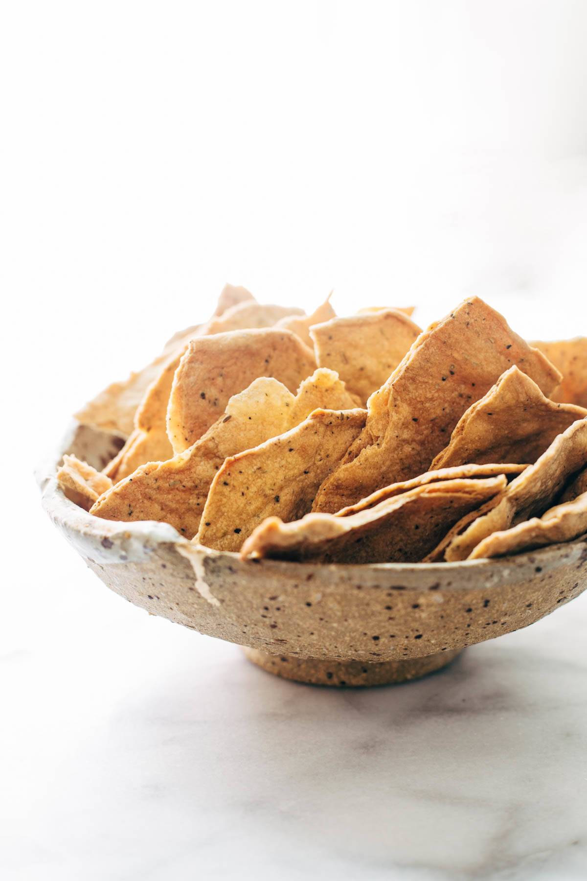 These easy homemade flatbread crackers are super adaptable and they are the perfect pair for cheese and wine. Crispy, real food, snacking perfection! | pinchofyum.com
