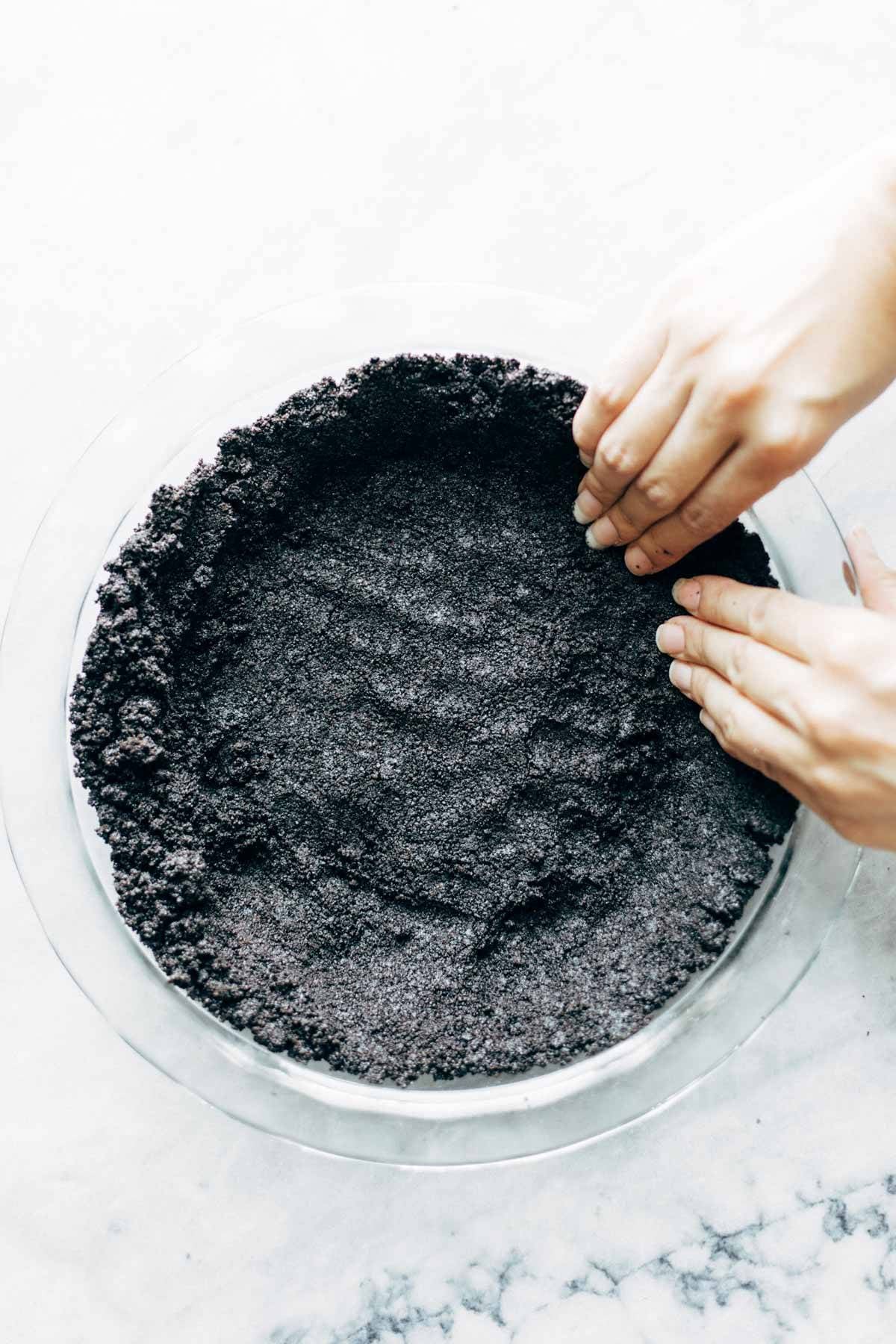 Pressing Mocha Peanut Butter Pie crust into pan.