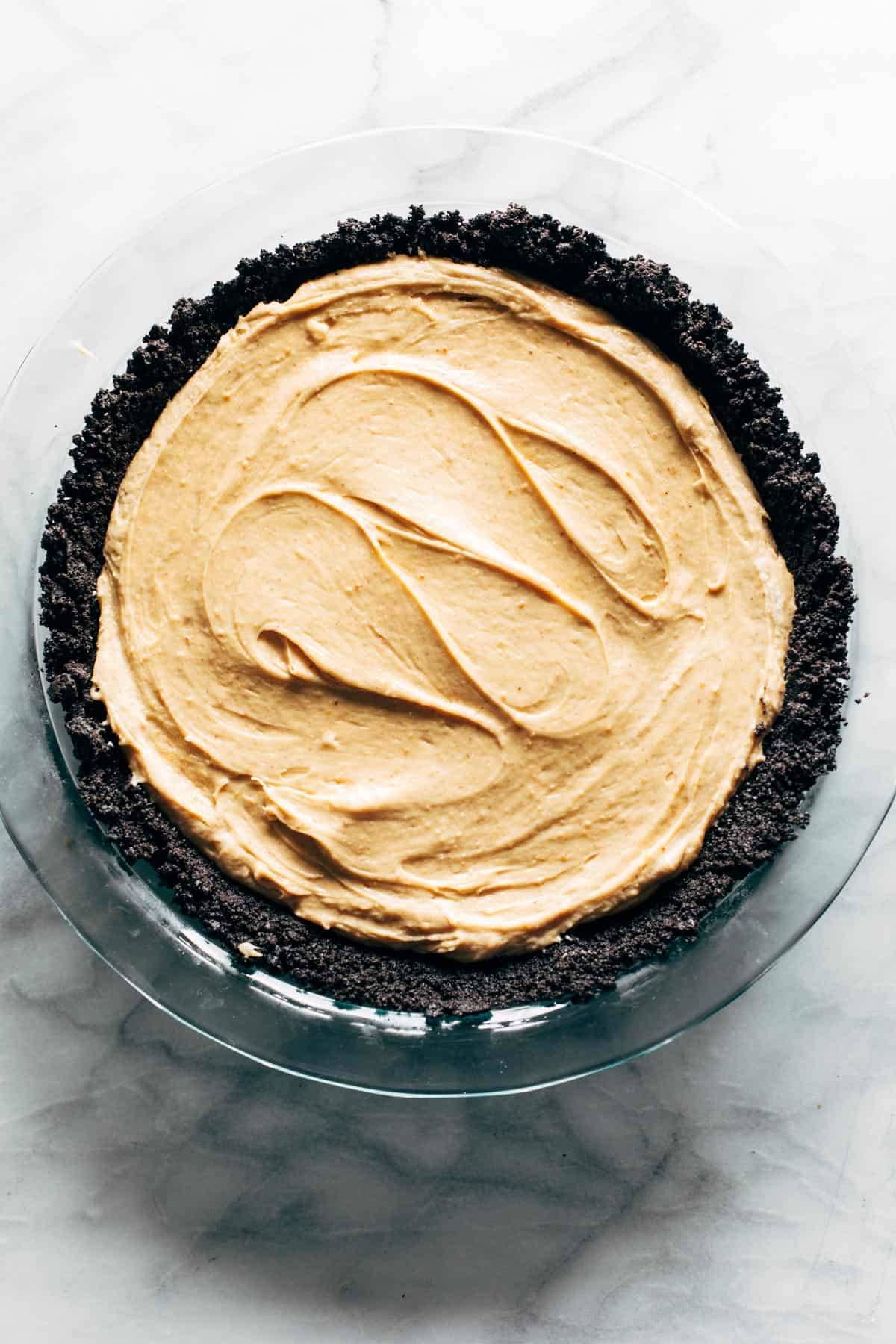 Peanut butter pie filling spread in crust.