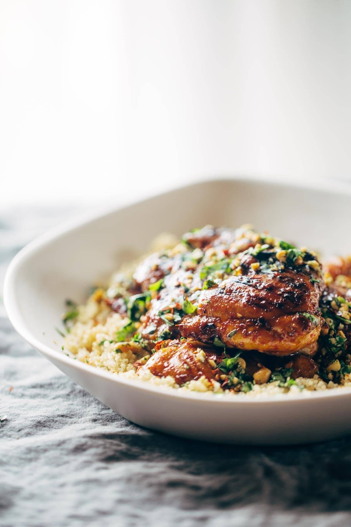 chicken and quinoa with cilantro in a bowl on a napkin
